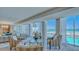 Bright and airy living room with comfortable seating and stunning beach and ocean views at 2301 Gulf Of Mexico Dr # 33N, Longboat Key, FL 34228
