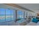 Beautifully furnished living room with floor to ceiling windows and an ocean view at 2301 Gulf Of Mexico Dr # 33N, Longboat Key, FL 34228