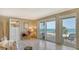 Bright living room area leading out to balcony with beach views at 2301 Gulf Of Mexico Dr # 33N, Longboat Key, FL 34228