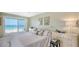 Comfortable main bedroom featuring light color walls, carpet flooring, and sliding glass door to the balcony at 2301 Gulf Of Mexico Dr # 33N, Longboat Key, FL 34228