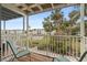 Relax on this balcony with wood floors, a white railing and views of lush landscaping and palm trees at 2326 Canal Dr # G25, Bradenton, FL 34207