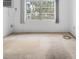 Bright bedroom featuring a large window and an air conditioning unit at 2326 Canal Dr # G25, Bradenton, FL 34207