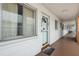 Hallway view of condo units with door mats and covered walkway at 2326 Canal Dr # G25, Bradenton, FL 34207