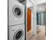 The laundry area features a stacked washer and dryer set, located near the bathroom at 2326 Canal Dr # G25, Bradenton, FL 34207