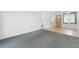 Bright living room with tiled floors transitioning to carpeted floors at 2326 Canal Dr # G25, Bradenton, FL 34207