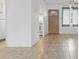 Bright living room with tile floors adjacent to kitchen at 2326 Canal Dr # G25, Bradenton, FL 34207