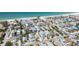 Aerial view of neighborhood homes situated close to beautiful beaches, with views of the water at 2408 Avenue B, Bradenton Beach, FL 34217