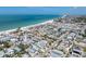 Aerial shot of the homes neighborhood highlighting it's beautiful beach and community charm at 2408 Avenue B, Bradenton Beach, FL 34217