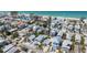 Aerial view showcases the house near the beach with a view of the ocean at 2408 Avenue B, Bradenton Beach, FL 34217
