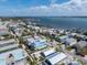 Aerial view of residential area with houses, pools, and water views at 2408 Avenue B, Bradenton Beach, FL 34217