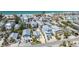 Aerial view of a charming coastal home with a metal roof, mature landscaping, and a prime location near the beach at 2408 Avenue B, Bradenton Beach, FL 34217