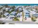 Stunning aerial view of colorful houses near the beach, showcasing its prime location at 2408 Avenue B, Bradenton Beach, FL 34217