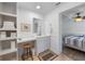 Bright bathroom featuring wainscoting, a single vanity, and coordinated fixtures at 2408 Avenue B, Bradenton Beach, FL 34217