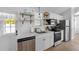 Modern kitchen features stainless steel appliances and granite countertops at 2408 Avenue B, Bradenton Beach, FL 34217