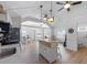 Bright kitchen overlooking the living room with an island bar and stainless steel appliances at 2408 Avenue B, Bradenton Beach, FL 34217
