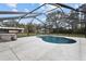 A beautiful screened-in pool and patio area for relaxation and entertainment at 27019 Golden Meadow Dr, Wesley Chapel, FL 33544