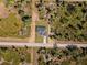 Aerial view of a modern home surrounded by verdant trees at 302 Liden St, Port Charlotte, FL 33953