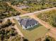 A new home shows off its landscaping from an aerial view at 302 Liden St, Port Charlotte, FL 33953