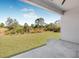 View from the covered patio to the level backyard at 302 Liden St, Port Charlotte, FL 33953