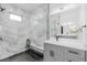 Bathroom featuring spacious glass shower with modern vanity and overhead lighting at 302 Liden St, Port Charlotte, FL 33953