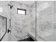 Bathroom featuring spacious glass shower with a seat and rainfall showerhead at 302 Liden St, Port Charlotte, FL 33953