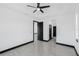 Primary bedroom with a ceiling fan, recessed lighting, and tile flooring, provides access to other rooms at 302 Liden St, Port Charlotte, FL 33953