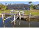 Boat lift detail on the canal behind the house, perfect for boaters at 3336 Tripoli Blvd, Punta Gorda, FL 33950