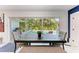 Dining area featuring a dark wood table and views through sliding glass doors to the outdoor pool area at 405 Magellan Dr, Sarasota, FL 34243