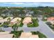 Aerial view of a residential neighborhood with lush landscaping, lawns, and houses at 4302 Turnberry Ct, Bradenton, FL 34210