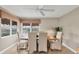 Neutral dining room featuring seating for six, with a hardwood table and views of the outdoors at 4302 Turnberry Ct, Bradenton, FL 34210