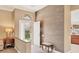 Foyer with tiled floors, textured wall, and a decorative glass accent window above the front door at 4302 Turnberry Ct, Bradenton, FL 34210