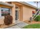 Inviting front entrance featuring decorative door, stone accents, and well-maintained landscaping at 4302 Turnberry Ct, Bradenton, FL 34210