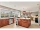Kitchen features stainless steel appliances, granite countertops, and a large island at 4302 Turnberry Ct, Bradenton, FL 34210