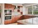 Modern kitchen with sleek granite countertops, stainless steel appliances, and ample cabinet space at 4302 Turnberry Ct, Bradenton, FL 34210