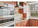 Modern kitchen features stainless steel appliances, granite countertops, and mosaic backsplash at 4302 Turnberry Ct, Bradenton, FL 34210