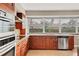 Bright kitchen with stainless steel appliances, granite countertops, and large window at 4302 Turnberry Ct, Bradenton, FL 34210