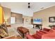 Relaxing living room featuring cozy seating, entertainment center, and neutral paint palette at 4302 Turnberry Ct, Bradenton, FL 34210