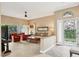 Bright living room with tile floors, comfortable seating, and large windows for natural light at 4302 Turnberry Ct, Bradenton, FL 34210