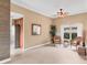 Bright living room with neutral walls and rattan seating at 4302 Turnberry Ct, Bradenton, FL 34210