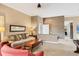 Living room featuring neutral tones, tiled flooring, and seamless flow into adjacent spaces at 4302 Turnberry Ct, Bradenton, FL 34210