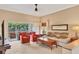 Comfortable living room with sliding glass doors to a screened lanai, inviting the outdoors in at 4302 Turnberry Ct, Bradenton, FL 34210