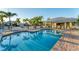 Community pool featuring a large pool deck and comfortable lounge chairs at 4302 Turnberry Ct, Bradenton, FL 34210