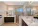 Bathroom featuring double sink vanity, a glass enclosed shower, and neutral paint at 4718 Claremont Park Dr, Bradenton, FL 34211