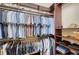 Walk-in closet with custom shelving, multiple rods, and organization options at 4718 Claremont Park Dr, Bradenton, FL 34211