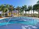 Community splash pad area offers a refreshing and playful retreat amidst well-manicured landscaping and clear blue skies at 4718 Claremont Park Dr, Bradenton, FL 34211