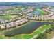 Panoramic aerial view of community with a large lake and golf course at 4719 Cabreo Ct, Bradenton, FL 34211
