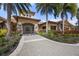 Beautiful entrance to the building featuring stone accents, manicured landscaping, and a paved walkway at 4719 Cabreo Ct, Bradenton, FL 34211