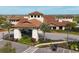 Elegant entrance to community with manicured landscaping and a porte-cochère at 4719 Cabreo Ct, Bradenton, FL 34211