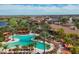 Large community pool with lounge chairs and palm trees at 4719 Cabreo Ct, Bradenton, FL 34211
