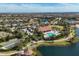 Aerial view of the community pool, clubhouse, bocce ball court, and surrounding neighborhood at 4719 Cabreo Ct, Bradenton, FL 34211